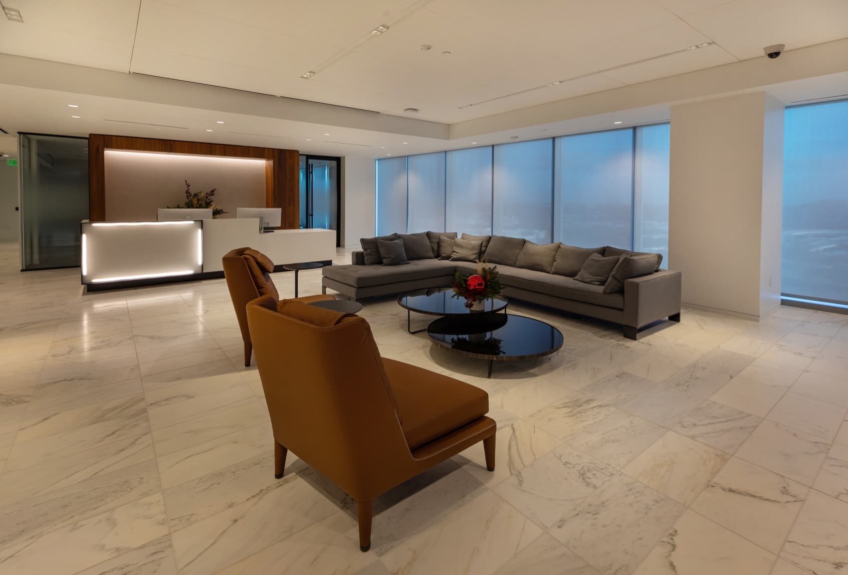 FIS World Headquarters — reception lounge with sheer motorized shades on the corner glazing