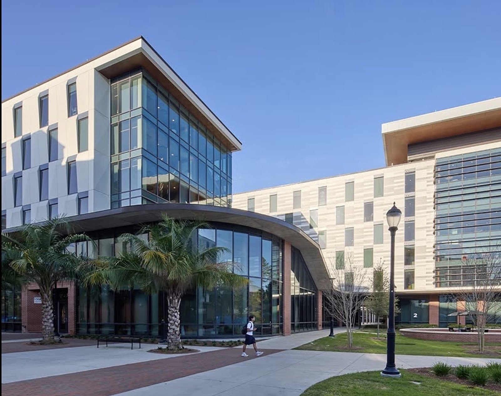 University of Florida Honors Village — residence hall exterior with curved-glass entry, Gainesville, FL