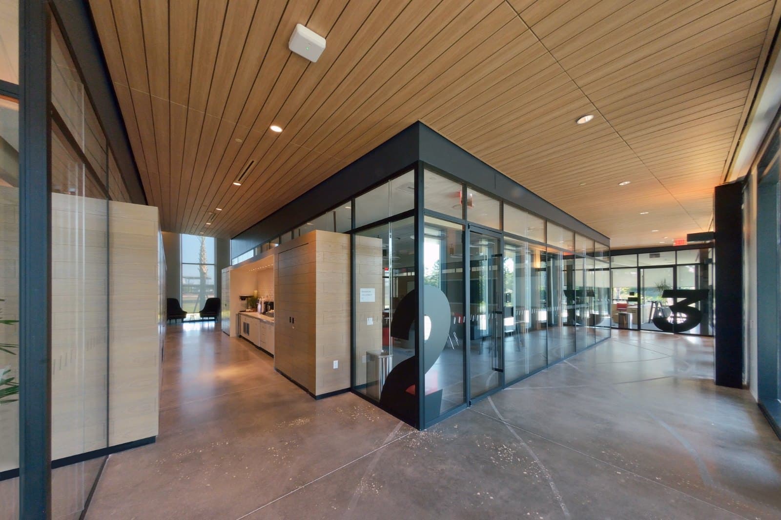 Johnson & Johnson HPI — glass-walled learning studios with motorized sheer shades