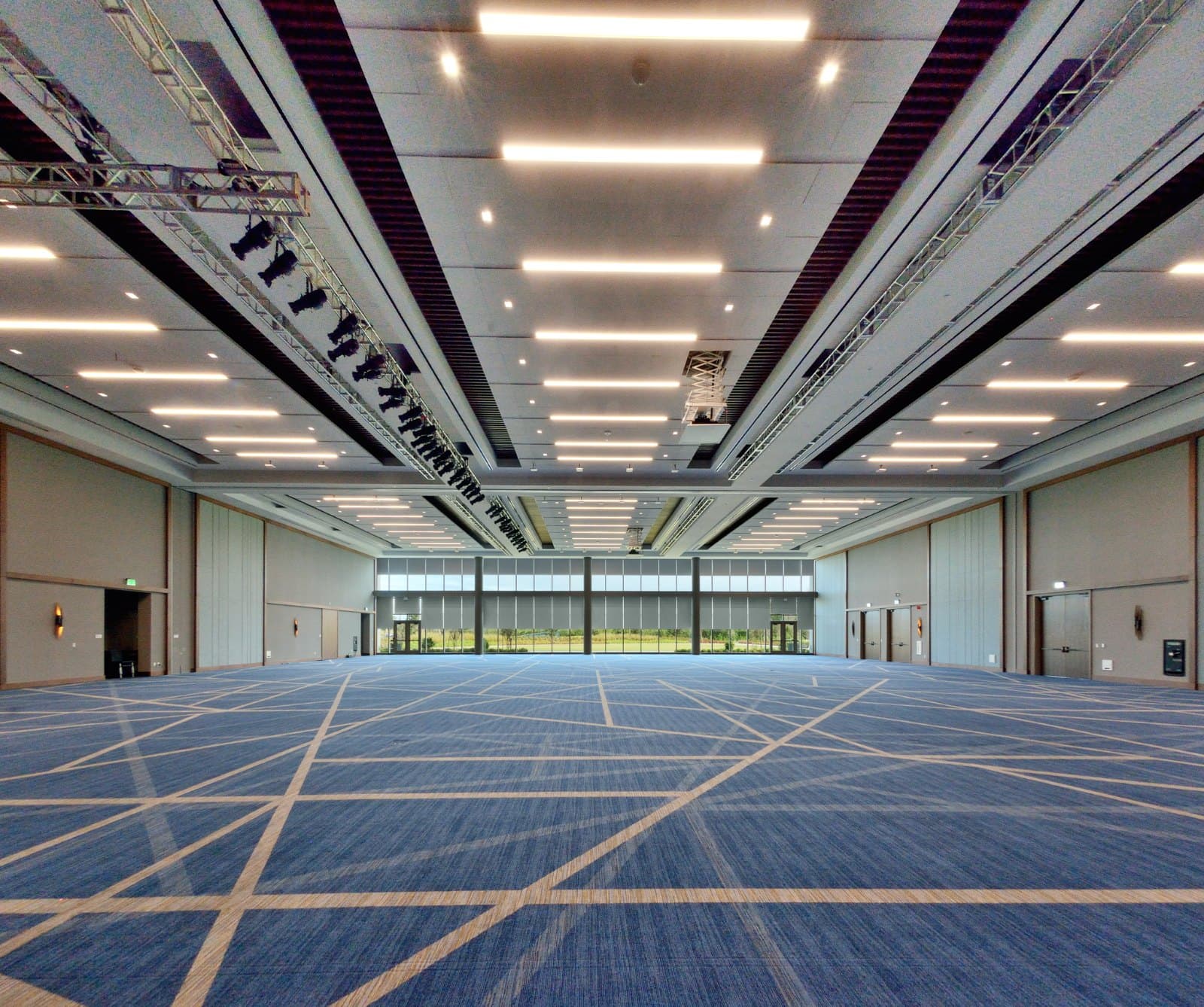 KPMG Lakehouse — ballroom with roller shades lowered two-thirds across the window wall
