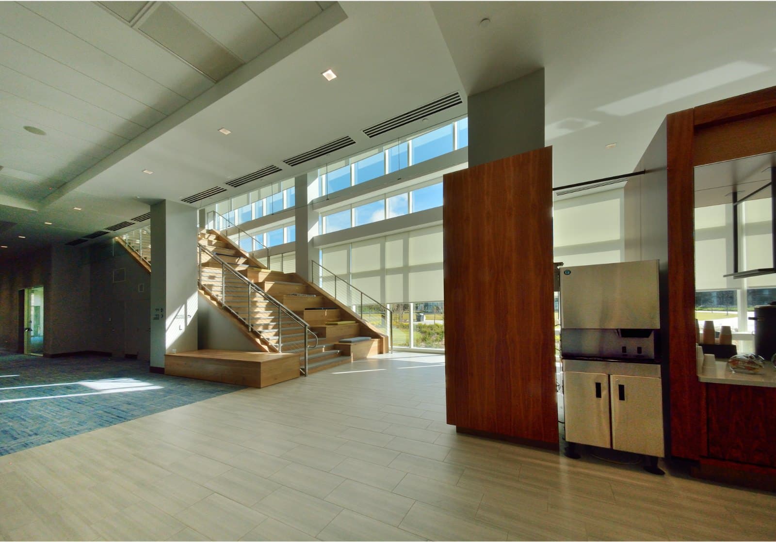 KPMG Lakehouse — lobby and feature stair with shades half-lowered
