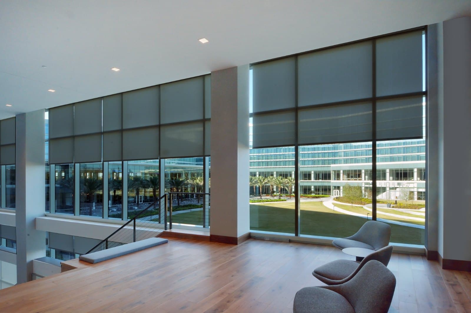 KPMG Lakehouse — corner meeting room with motorized roller shades and campus views